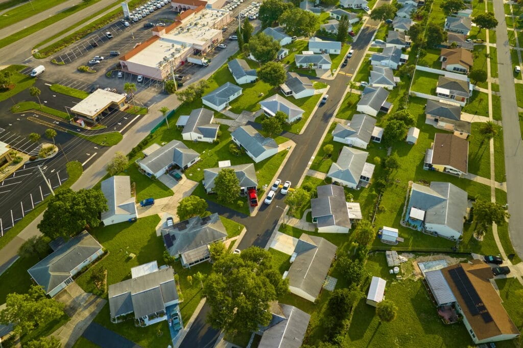 Aerial view of a suburban Florida neighborhood with tree cover