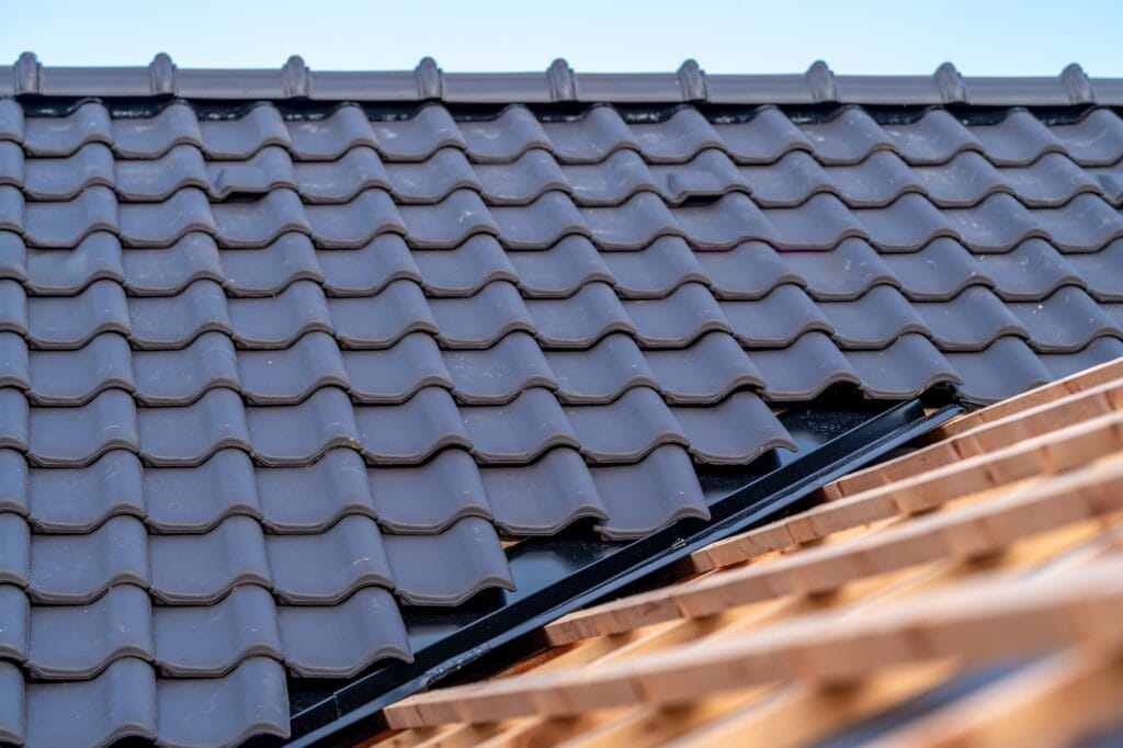 construction of the roof of a family house, wooden beams and ceramic bags