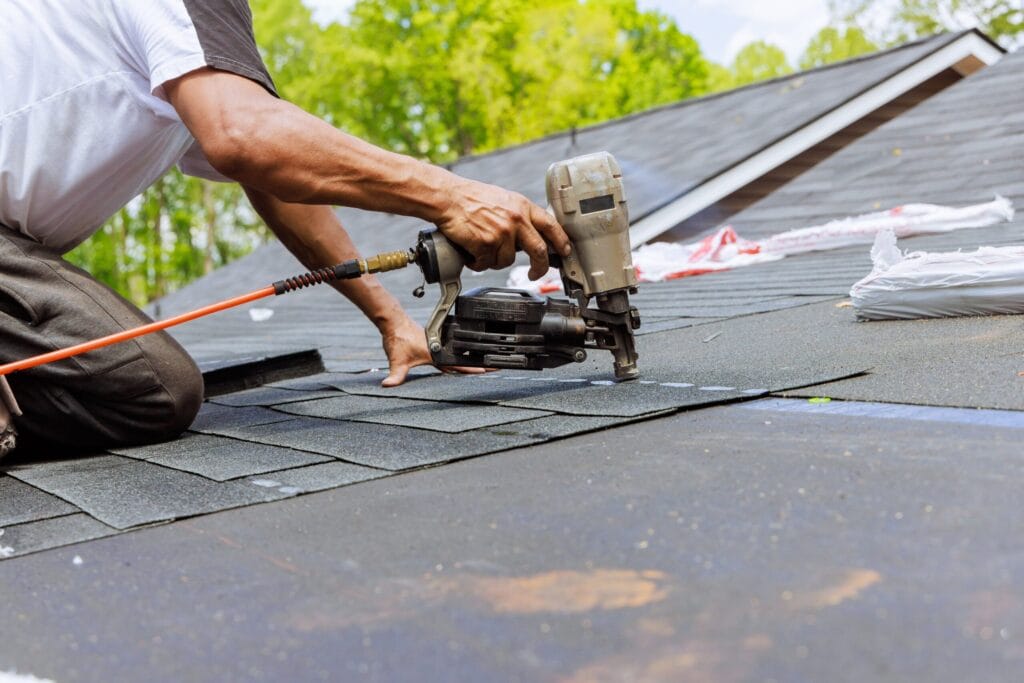 Skilled roofing contractors replacing old and damaged roofs with quality materials