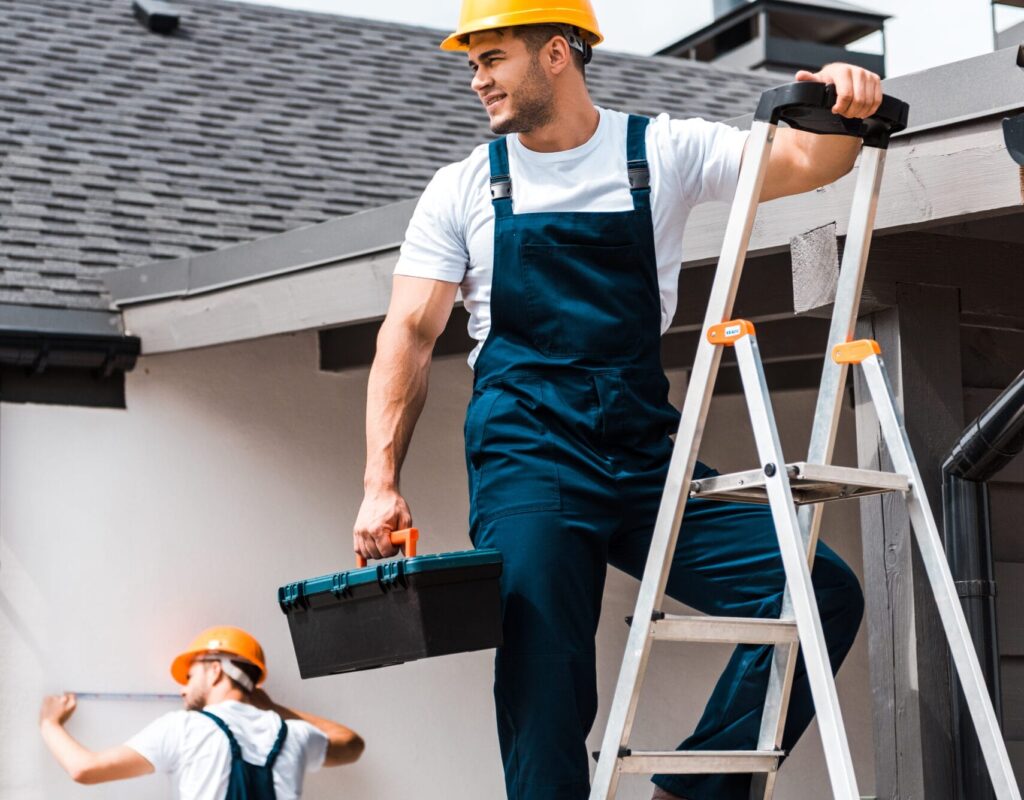 selective focus of workman standing on ladder with 2024 11 08 14 40 09 utc